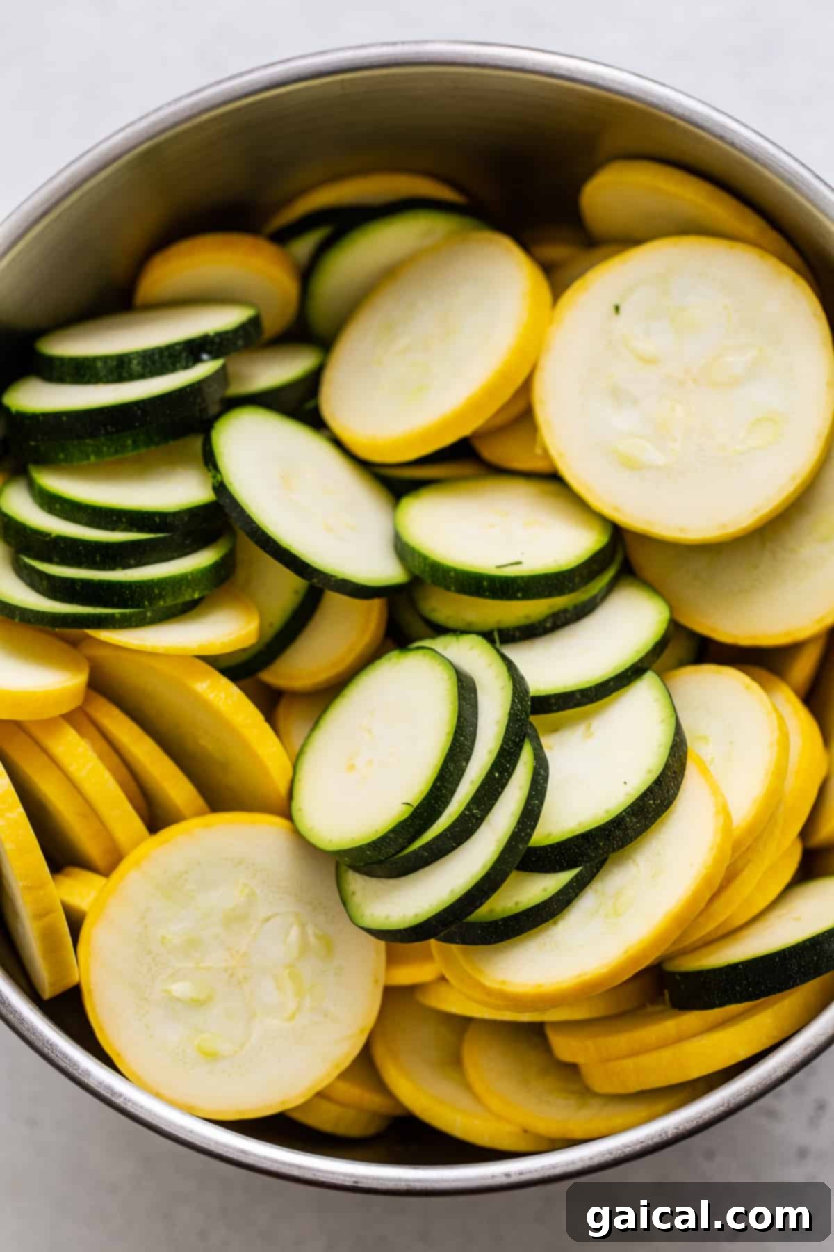 Vibrant Summer Squash Pasta 3 Sliced yellow squash and zucchini arranged in a bowl, ready for cooking.