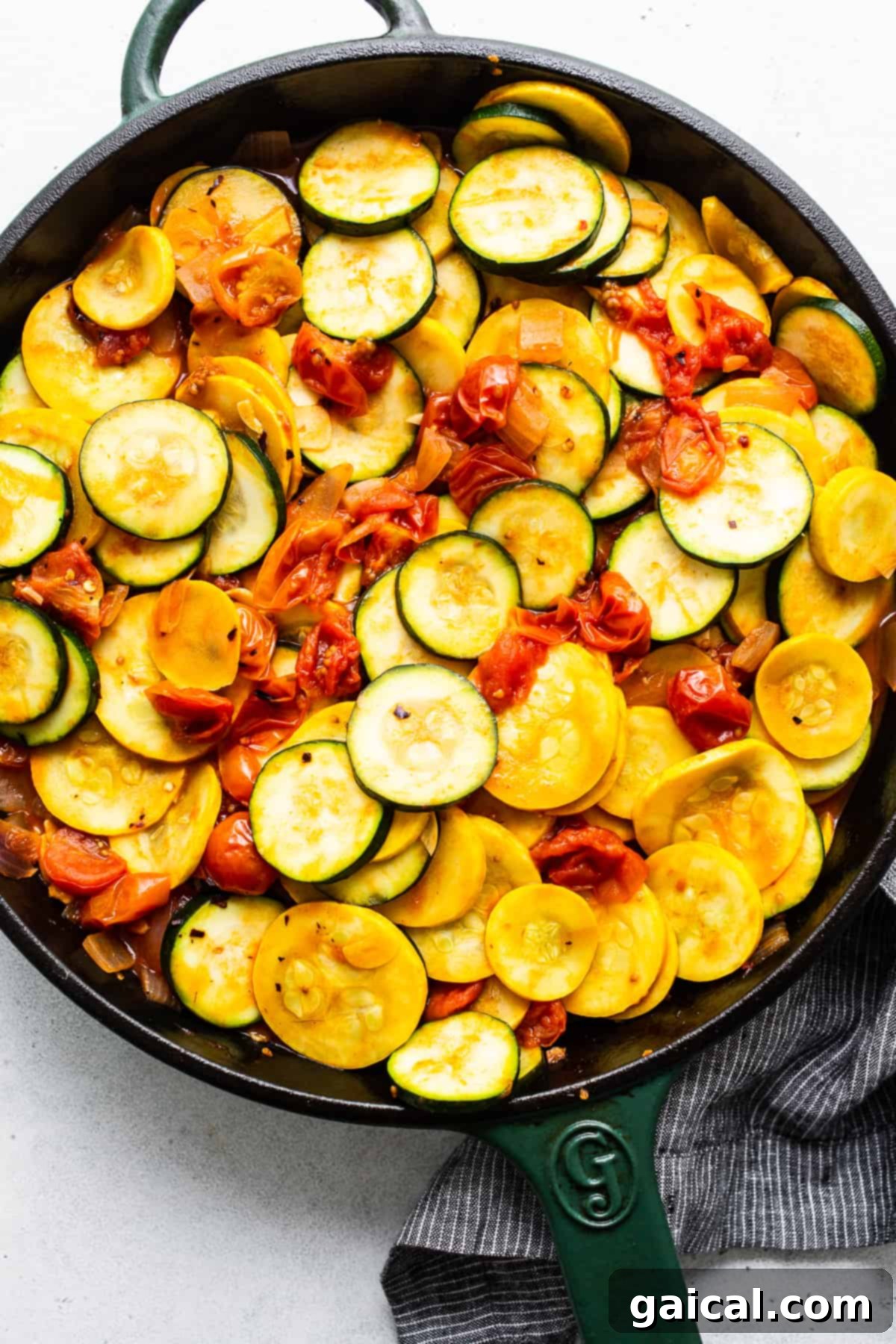 Vibrant Summer Squash Pasta 4 Sautéed zucchini and yellow squash tossed with cherry tomatoes and pasta sauce in a cast iron skillet.