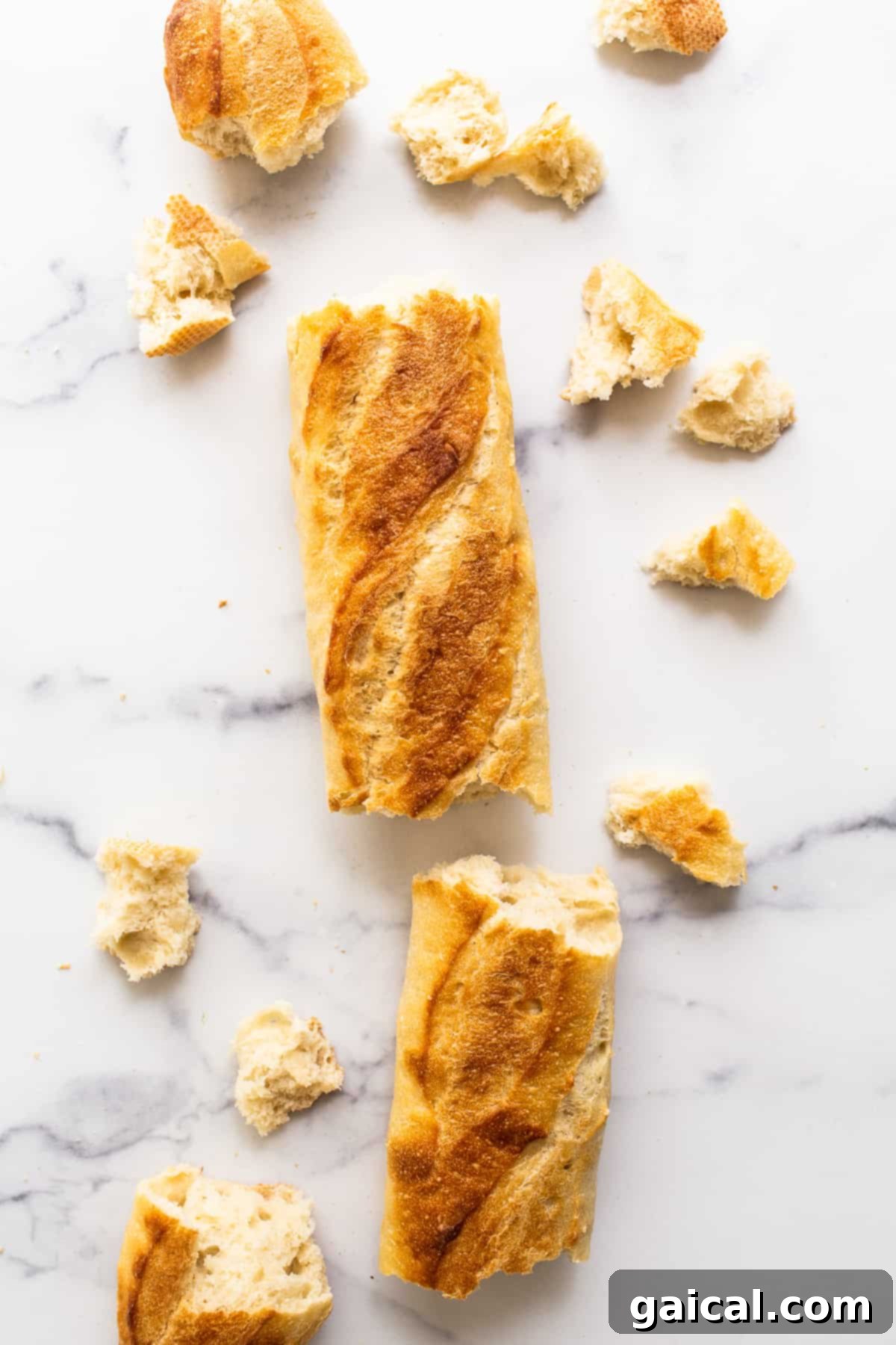 Fresh French Baguette for Homemade Croutons A fresh, crusty French baguette resting on a kitchen countertop, ready to be transformed into delicious homemade croutons.