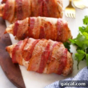 perfectly cooked bacon wrapped chicken on a cutting board