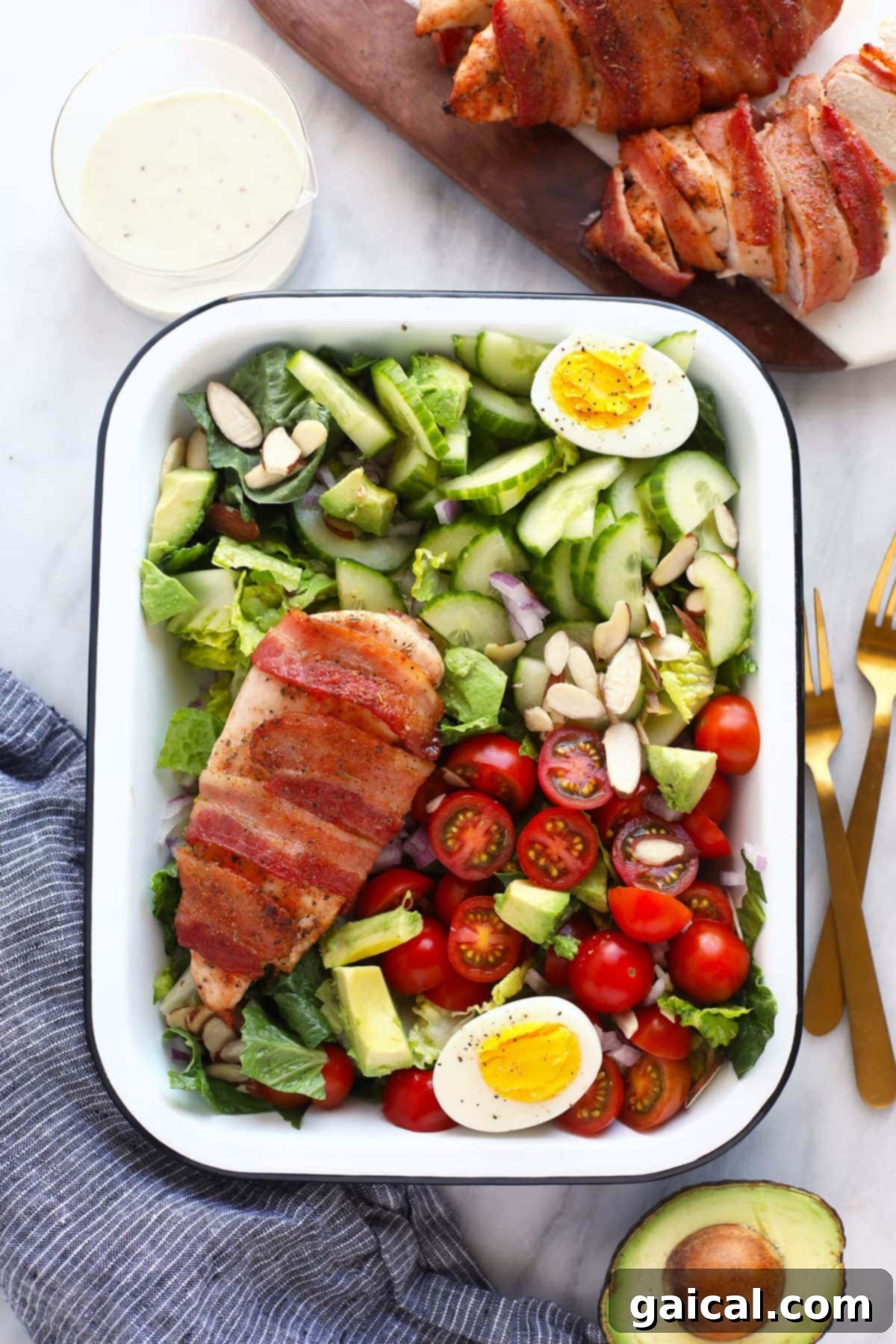 finished chicken salad in a dish with two forks