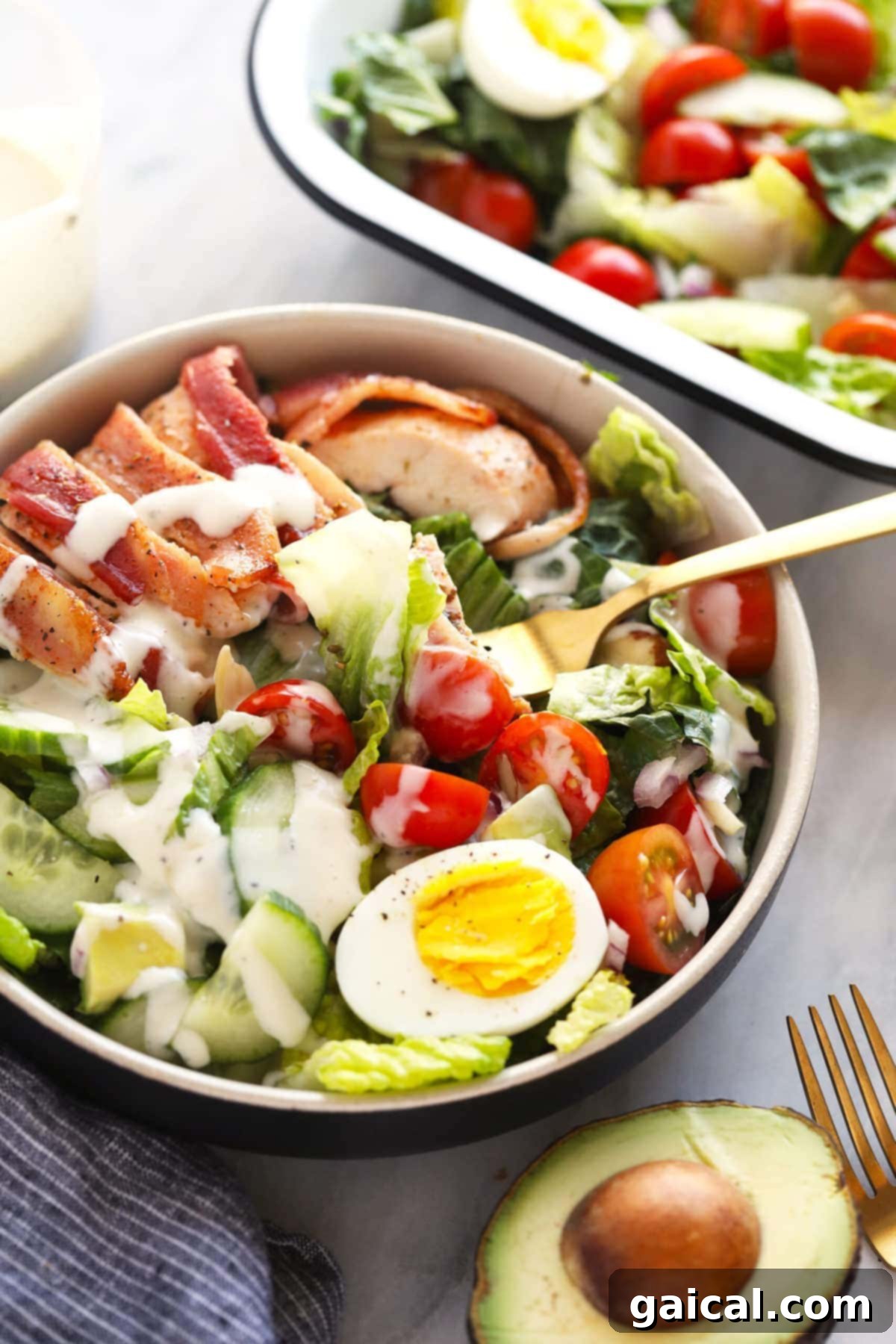 a fork digging into a delicious chicken salad