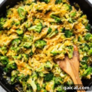 Cheesy Broccoli Orzo Bake 3 Finished broccoli cheese casserole served in a square bowl.