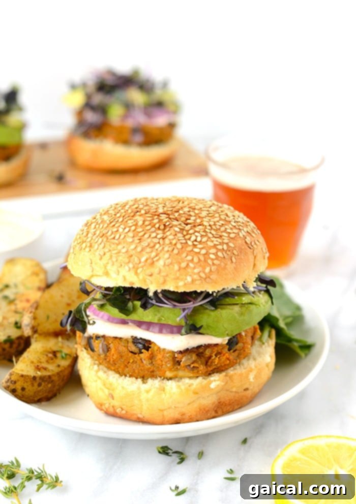Half of a sweet potato burger on a plate, showcasing its vibrant interior