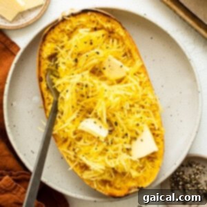 Baked spaghetti squash on a plate, ready to be enjoyed.