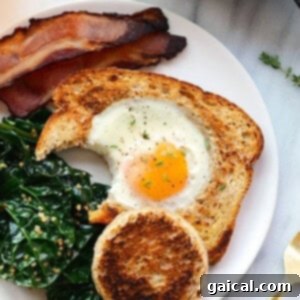 Egg in a frame on a plate, ready to be eaten, showcasing a perfect sunny-side up yolk