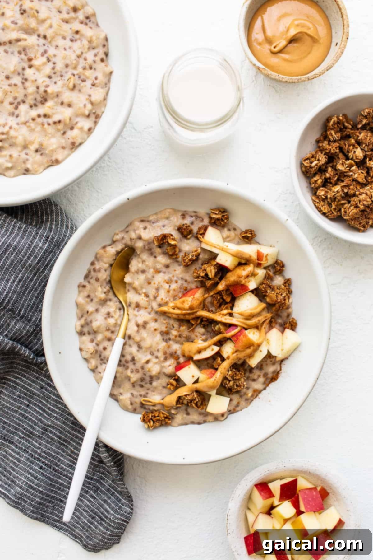 A comforting bowl of apple cinnamon oatmeal with a spoon resting inside, inviting you to take a bite.