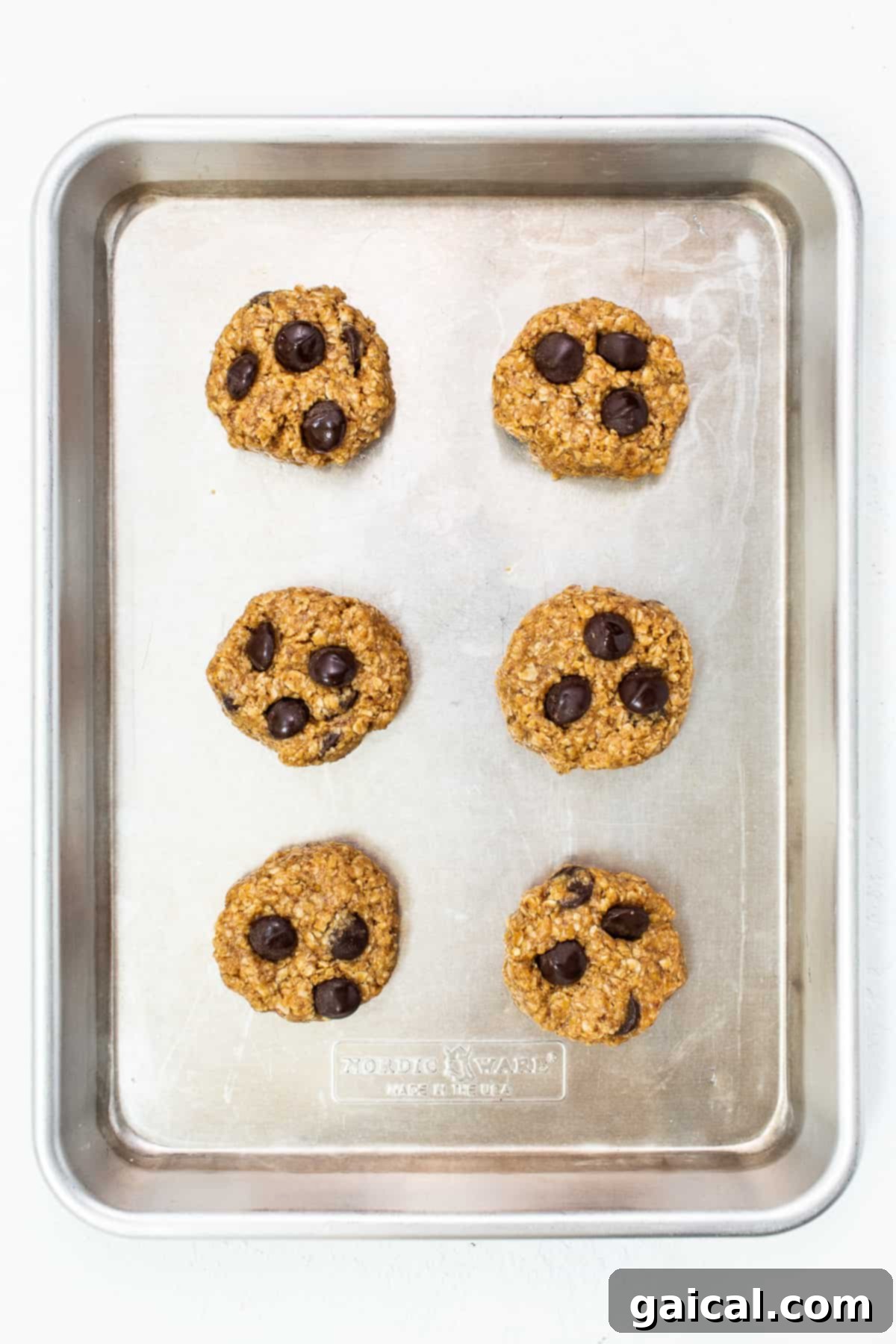 Warm lactation cookies fresh out of the oven on a baking sheet.