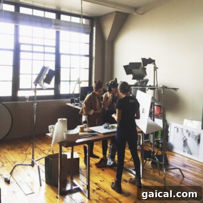 My April Unfolding 6 Team Fit Foodie filming a new recipe video in the kitchen studio, showcasing delicious and healthy food content production.