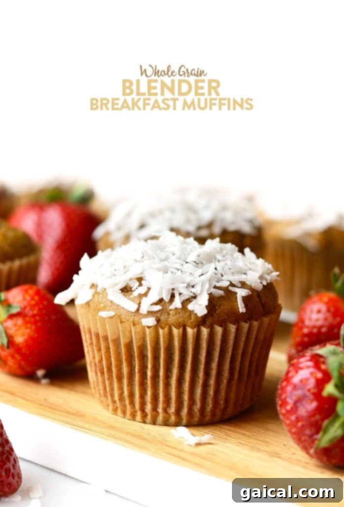 Healthy whole grain blender breakfast muffins made with pureed strawberries and bananas and 100% white whole wheat flour.