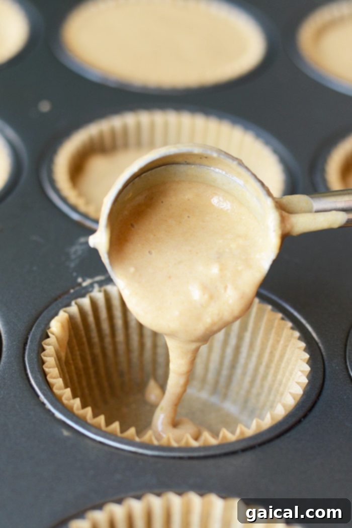 Wholesome blender breakfast muffins with fresh strawberries and bananas, made with whole wheat flour.