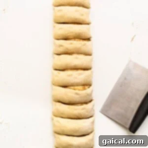 A rolled dough log, ready for slicing.