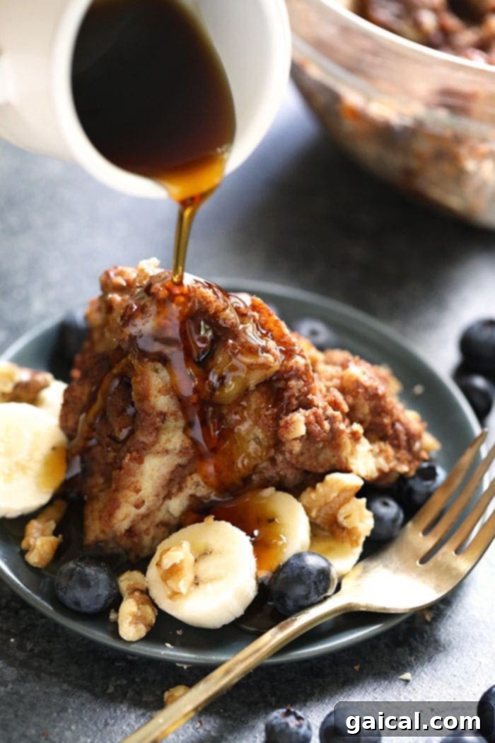 Instant Pot French Toast Bake: Easy Cinnamon Roll Casserole French Toast Casserole being drizzled with maple syrup