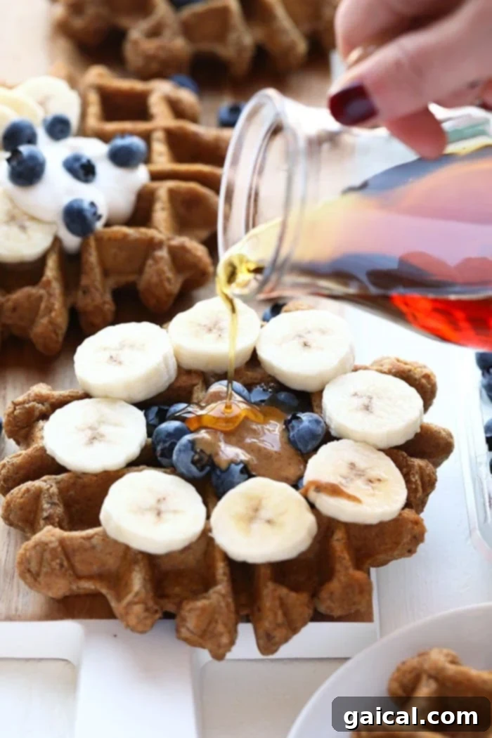 Vegan Almond Butter Banana Bread Waffles: Healthy & Freezer-Friendly Vegan waffles on a plate