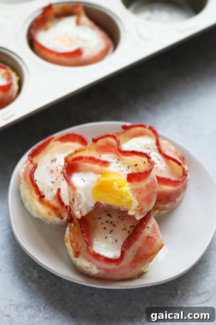 Bacon Wrapped Egg Cups: Quick & High-Protein Breakfast Meal Prep Bacon wrapped egg cups on a plate