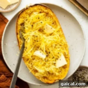 Perfectly roasted spaghetti squash on a plate, showing its natural strands.