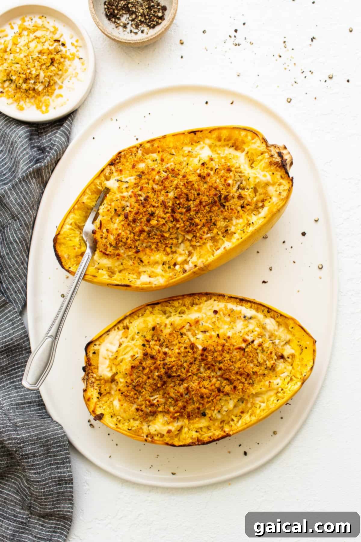 Close-up of baked Spaghetti Squash Mac and Cheese, topped with golden-brown breadcrumbs, fresh from the oven and ready to serve.