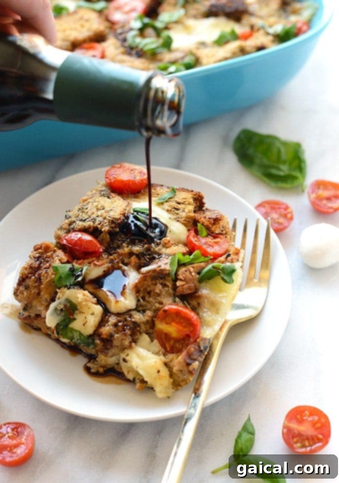 Caprese Sunrise Strata 2 A beautifully baked Caprese Egg Bake, featuring golden-brown bread, melted mozzarella, and bright red tomatoes, ready to be served. It's a perfect fusion of egg bake and Caprese salad.
