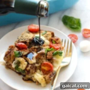 A person is pouring sauce on a Caprese Egg Bake.