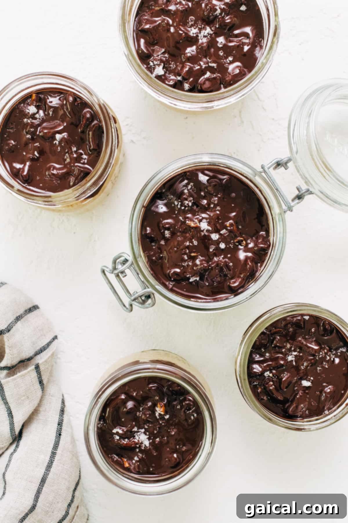 Chilling Pumpkin Mousse Jars Pumpkin mousse in mason jars with chocolate topping chilling.