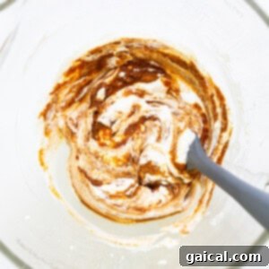 Whipped Pumpkin Spice Dream 4 A bowl of whipped cream with a spoon in it.