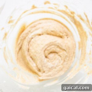 Whipped Pumpkin Spice Dream 5 A bowl with a mixture in it.