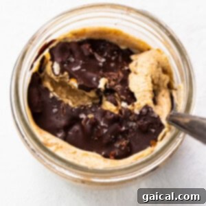 Whipped Pumpkin Spice Dream 8 Peanut butter in a glass bowl with a spoon.