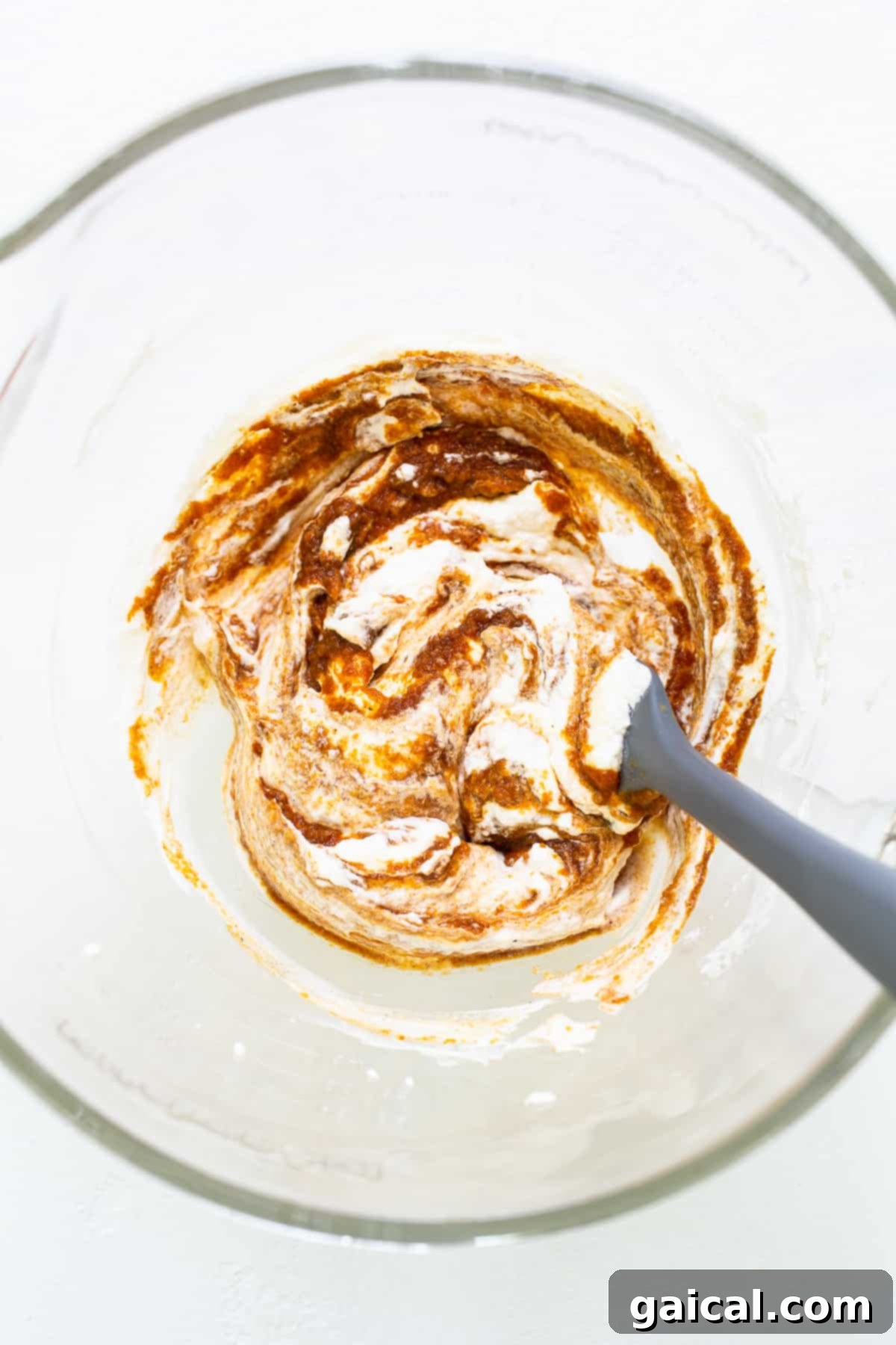 Folding Whipped Cream into Pumpkin Base Pumpkin mixture combined with fluffy whipped cream for the mousse.