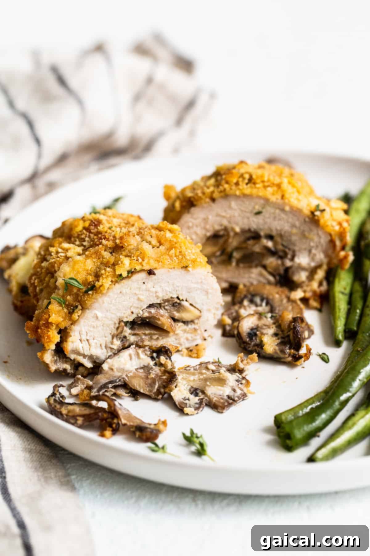 Ultimate Stuffed Pork Chops with Cheesy Mushroom Filling & Crispy Cracker Topping Crispy mushroom stuffed pork chops served on a plate, ready for a delicious meal.