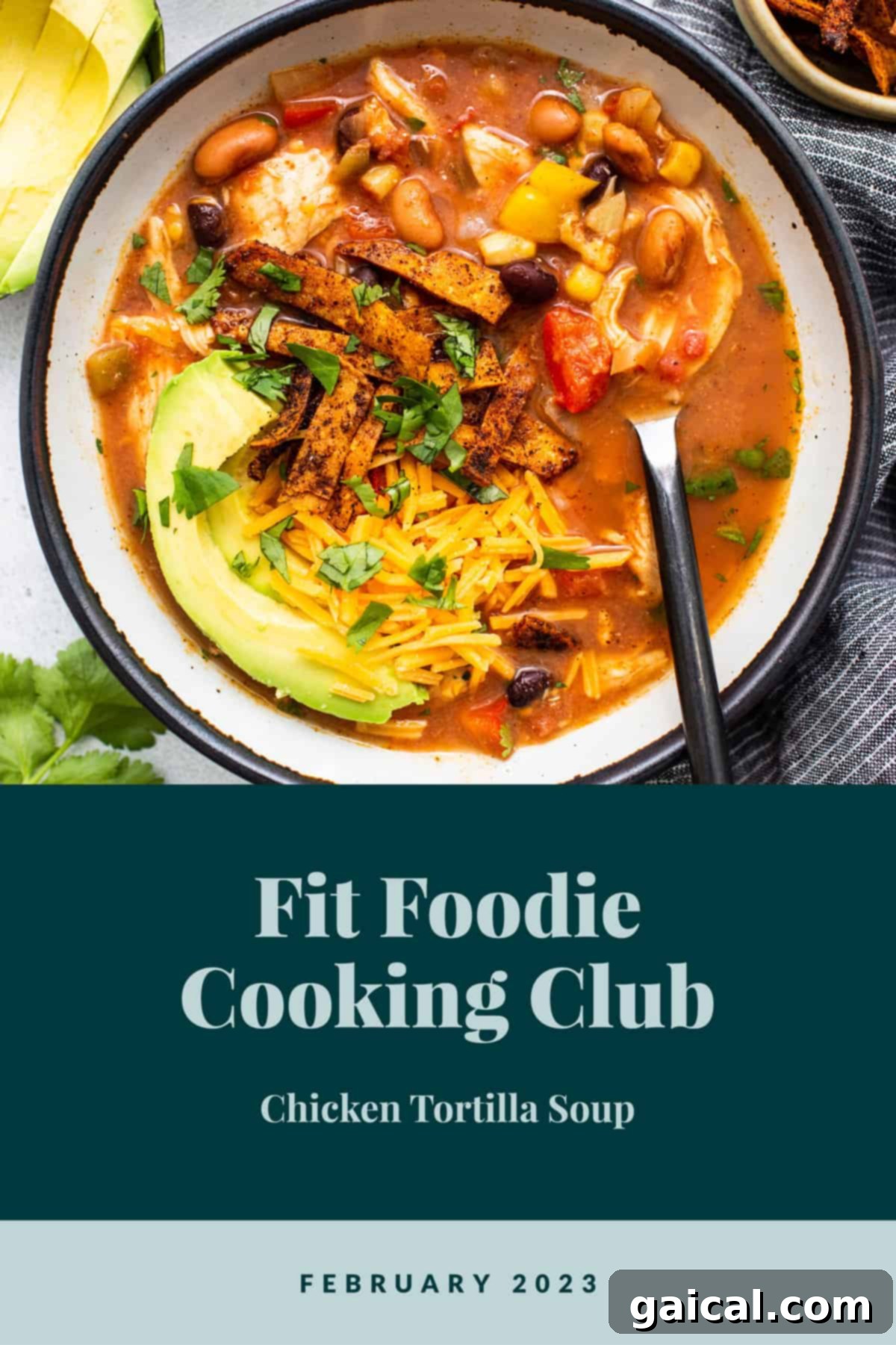 A vibrant bowl of chicken tortilla soup, garnished with fresh cilantro and tortilla strips, ready to be enjoyed.