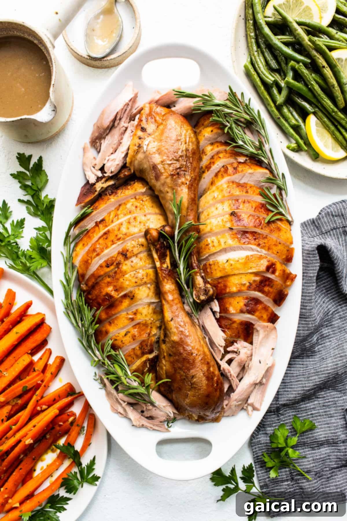 The Ultimate Thanksgiving Turkey Guide 2 Perfectly sliced, juicy Thanksgiving turkey on a elegant platter, garnished with fresh herbs, ready to be served.