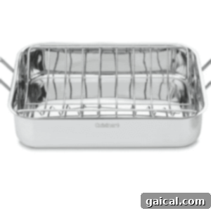 The Ultimate Thanksgiving Turkey Guide 7 A high-quality stainless steel roasting pan with an integrated V-rack, shown against a clean white background.