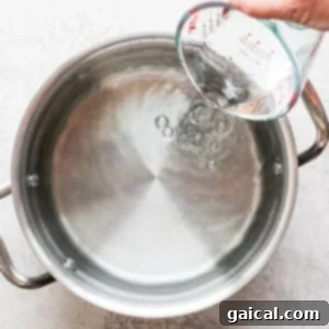 Adding water to pot.