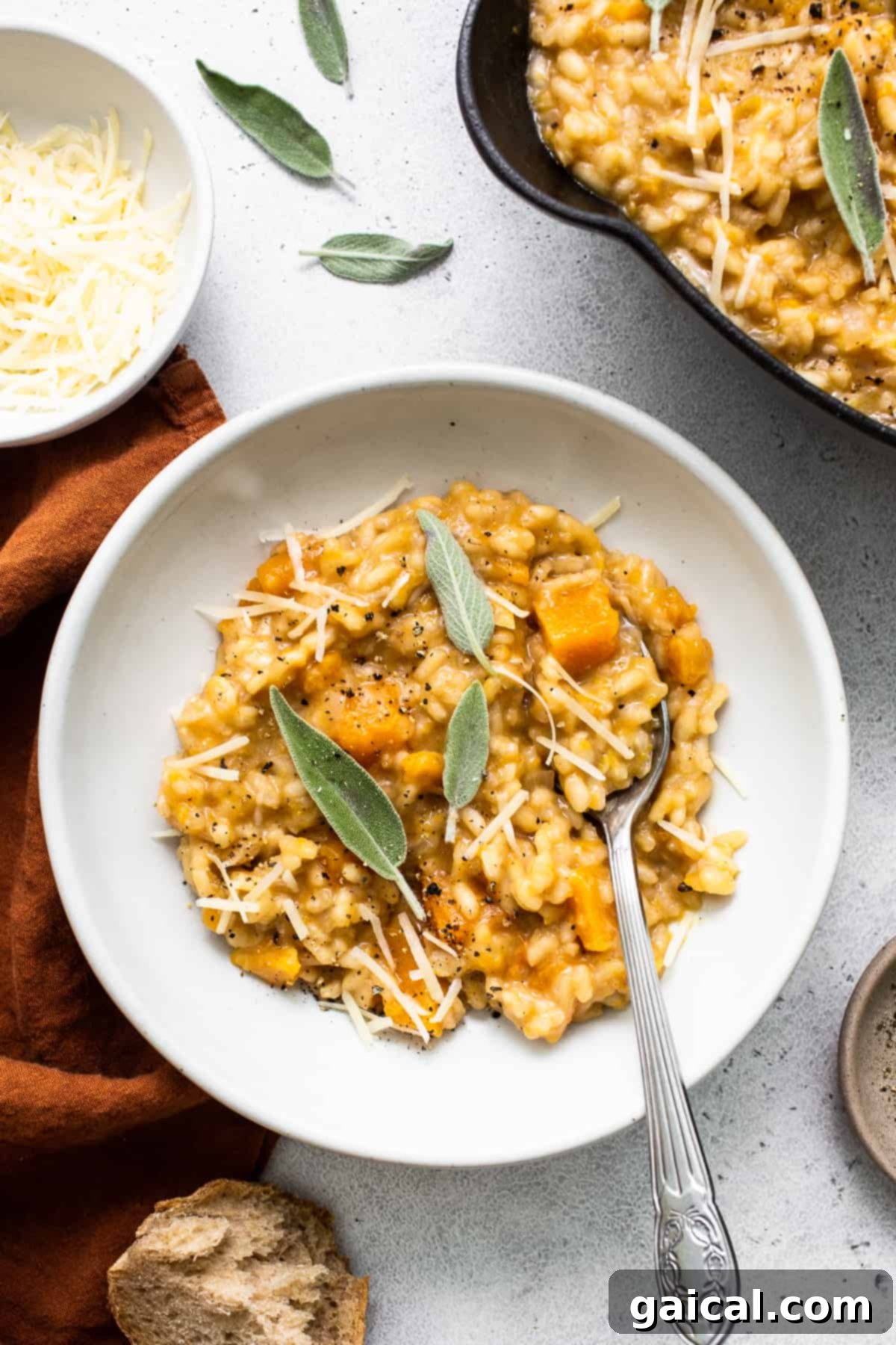 Velvety Butternut Squash Risotto 9 Close-up of a skillet filled with rich and creamy butternut squash risotto, perfectly prepared and ready to be served as a delightful fall dinner.