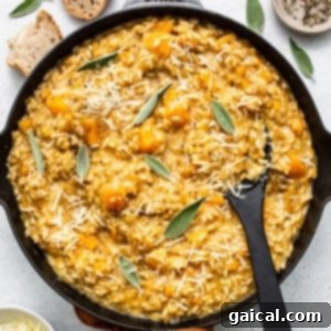 Fit Foodie Finds creates a nutritious pumpkin risotto in a skillet, filled with the flavors of sage and parmesan.