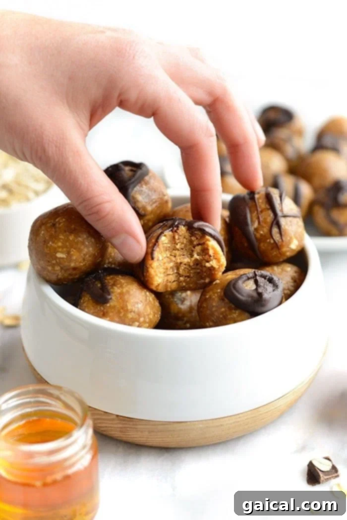 Delicious Peanut Butter Energy Ball for a Quick Snack Grabbing a peanut butter energy ball, highlighting convenience and deliciousness