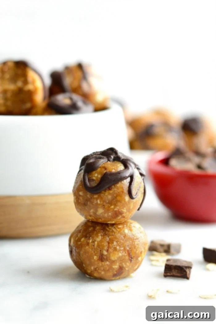 Stacked Homemade Peanut Butter Energy Balls Stacked peanut butter energy balls, showcasing their appealing texture and snackability