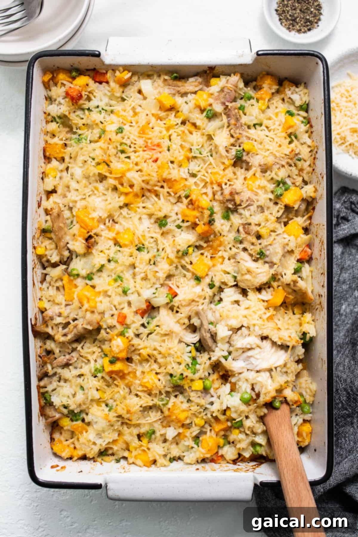 A rich turkey and vegetable casserole, golden brown from the oven, in a baking dish.