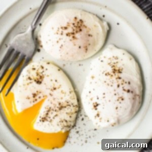The star of your breakfast: a perfect poached egg. A perfectly poached egg ready to be served, showing its firm white and potential for a runny yolk.