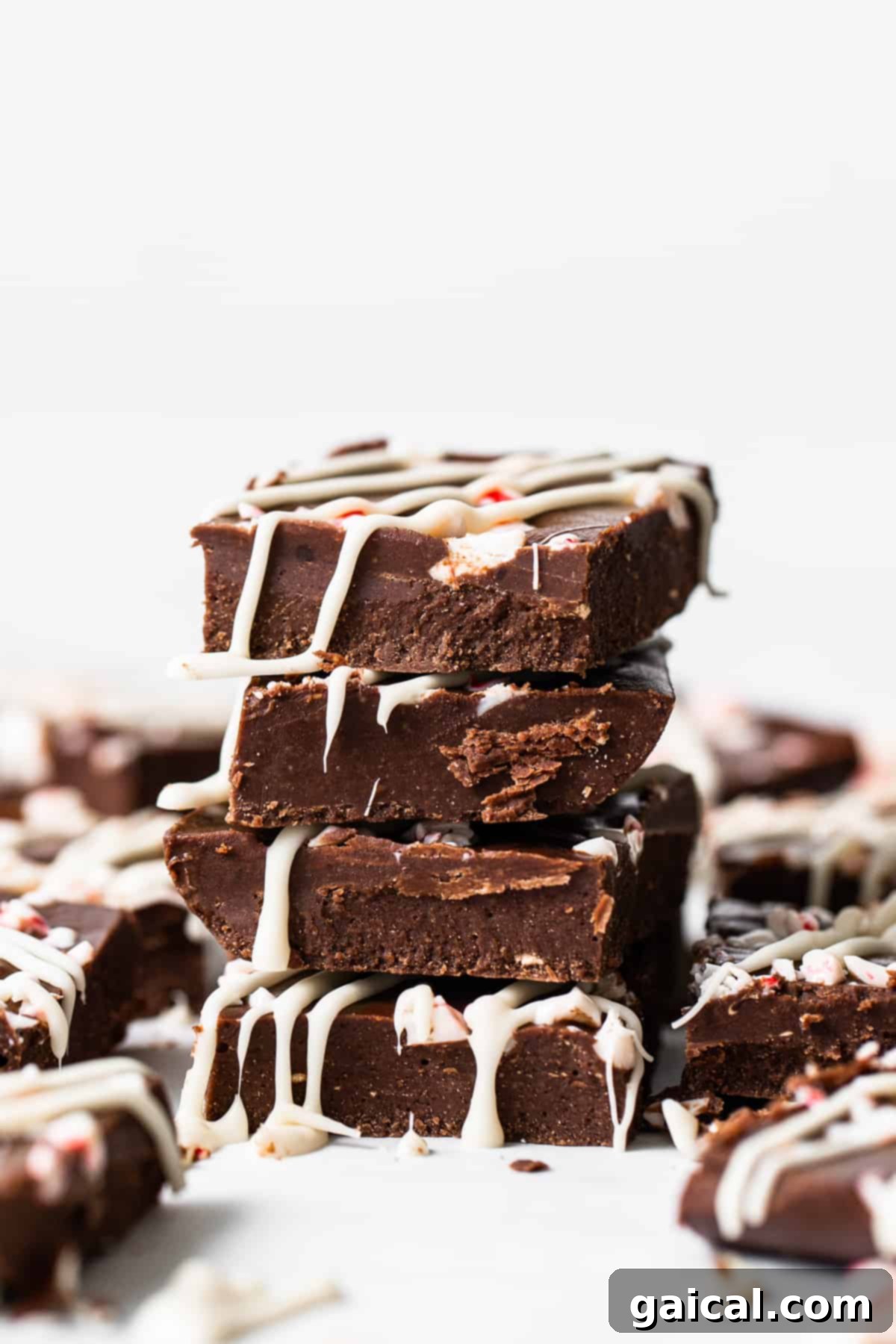Arctic Peppermint Fudge 2 Stacked fudge pieces, showing the creamy texture and crushed peppermint topping.