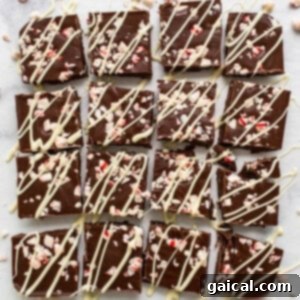Finished peppermint freezer fudge, cut into squares on a serving board.
