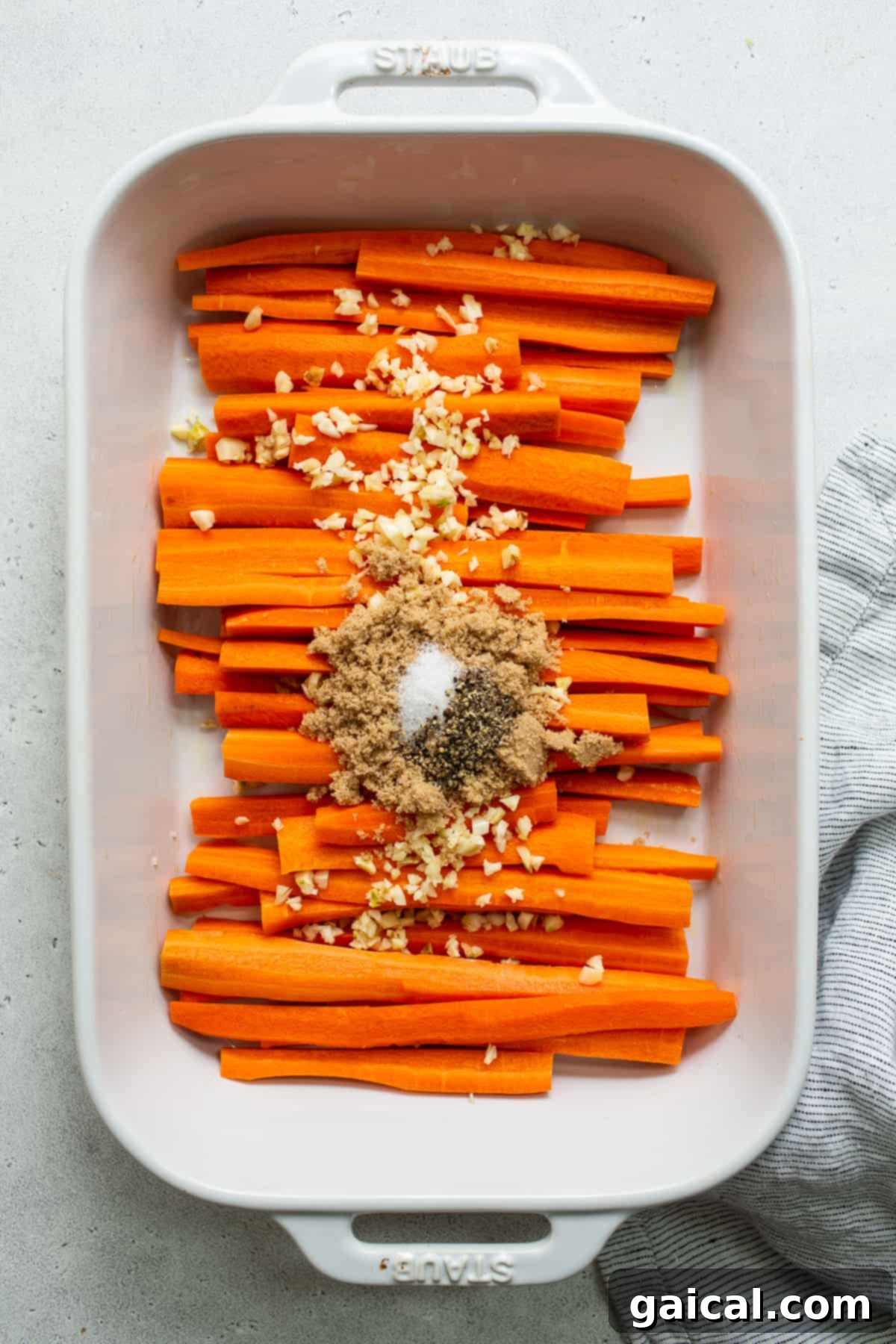 Easy One-Pan Garlic Glazed Carrots for Any Occasion Garlic glazed carrots perfectly roasted and arranged in a casserole dish, ready to be served.