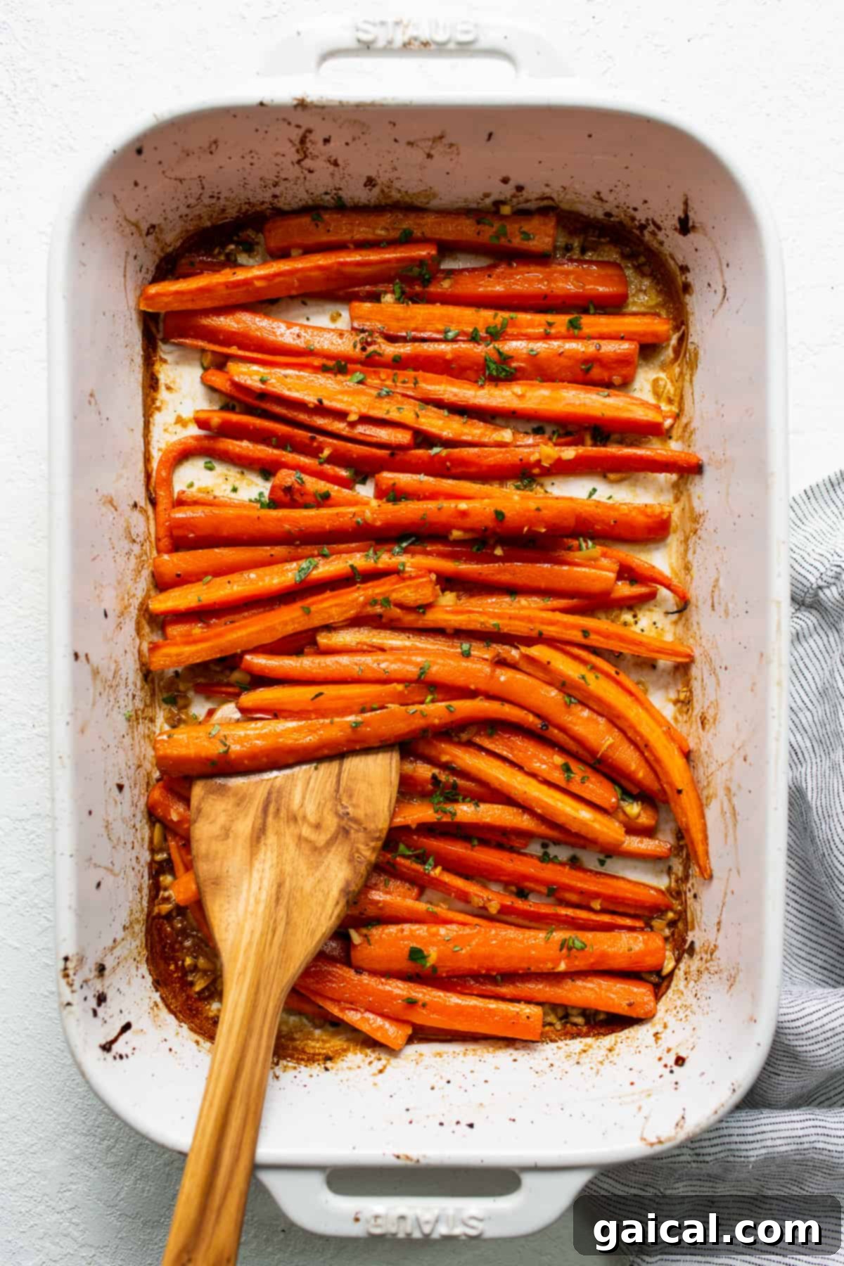 Caramelized Garlic Glazed Carrots Fresh from the Oven Beautifully roasted garlic glazed carrots with a golden-brown finish, ready to be tossed and served.