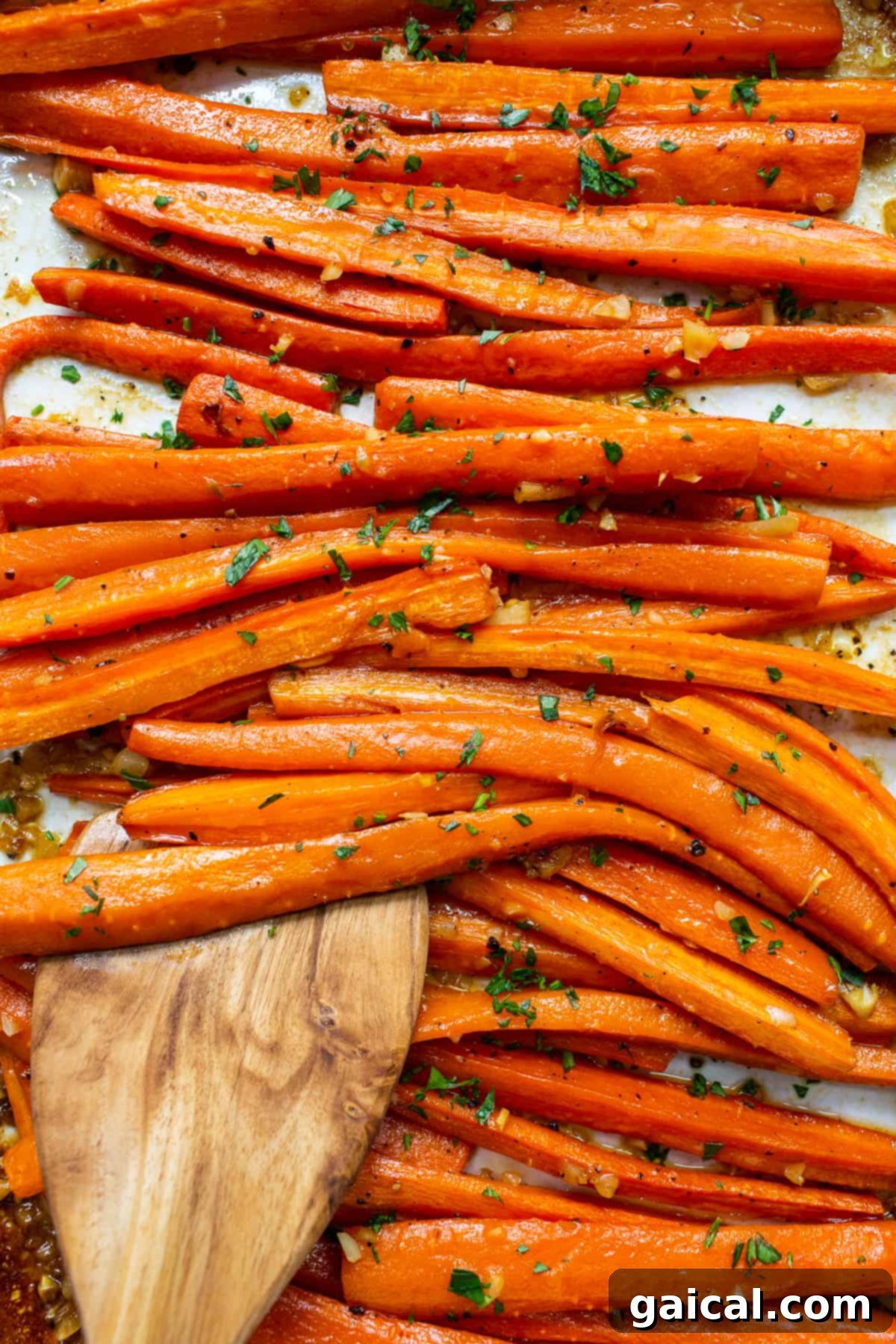 Freshly Garnished Garlic Glazed Carrots: Aromatic & Appetizing Close-up of roasted garlic glazed carrots garnished with fresh parsley, emphasizing their tender texture and vibrant appearance.