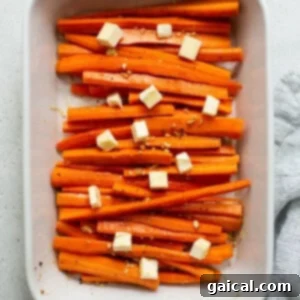 Sliced carrots in a white baking dish.