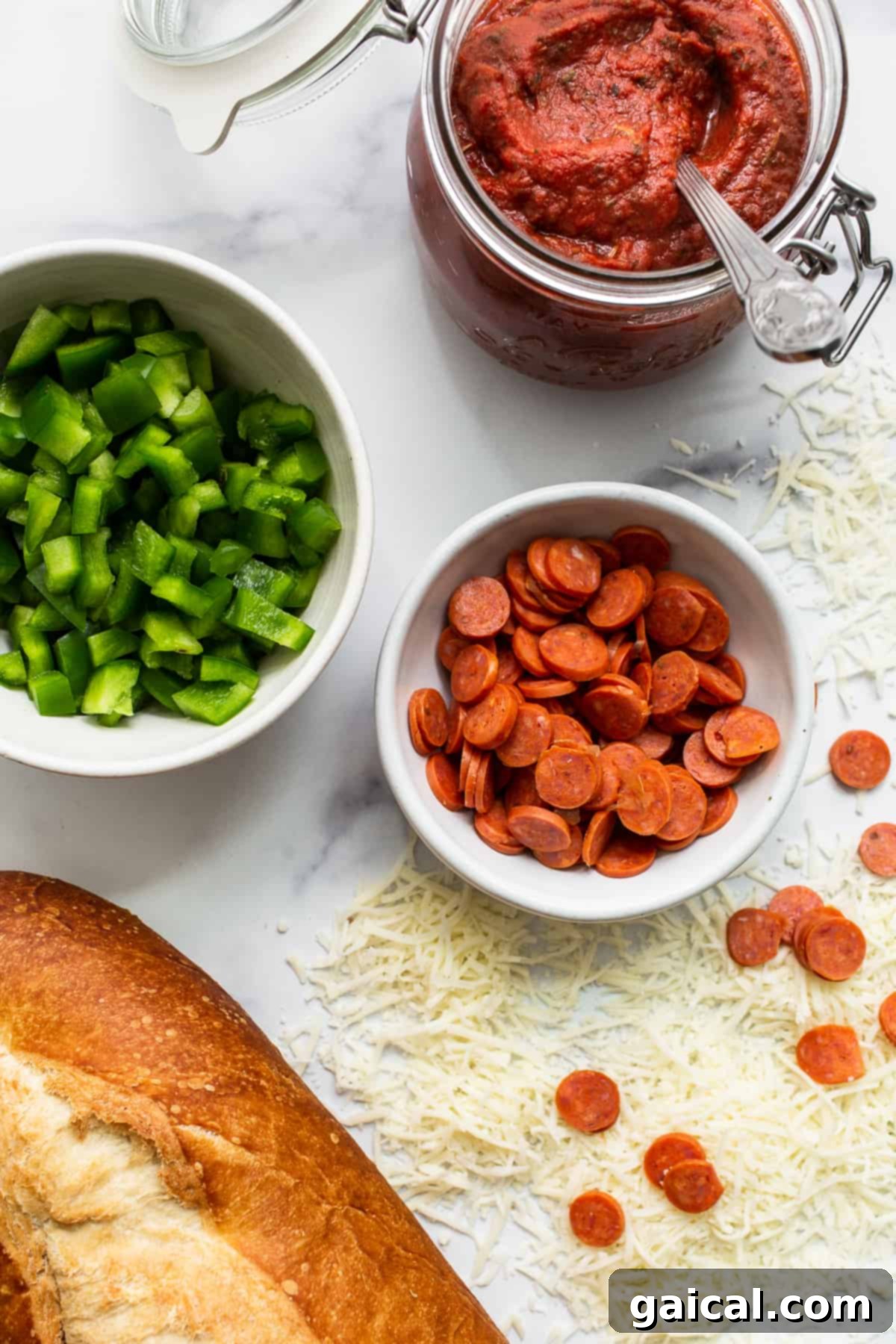 Fresh Ingredients for Your Homemade French Bread Pizza All the essential ingredients for French bread pizza laid out neatly on a kitchen counter.