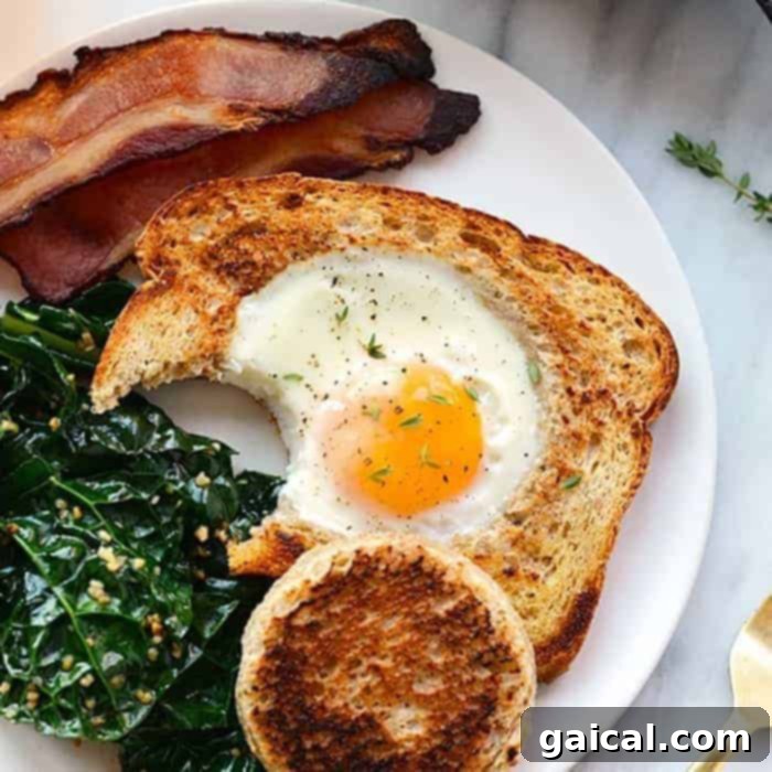 15+ Creative Egg Breakfasts to Kickstart Your Day 15 A perfectly cooked egg in a frame served on a plate, showcasing its golden toast and creamy yolk.