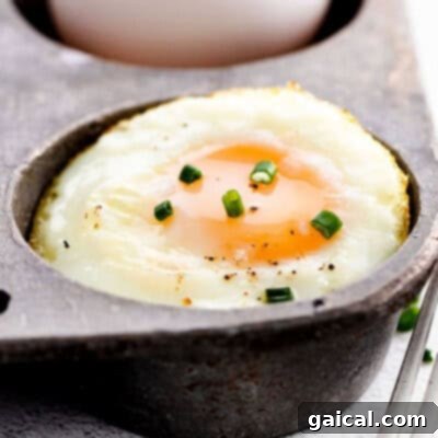 A beautifully baked egg, cooked to perfection in a cast iron pan, ready for a healthy breakfast.