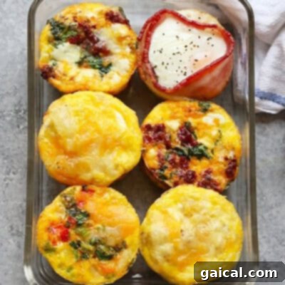 A glass dish filled with assorted breakfast egg cups, perfect for a healthy, meal-prepped breakfast.