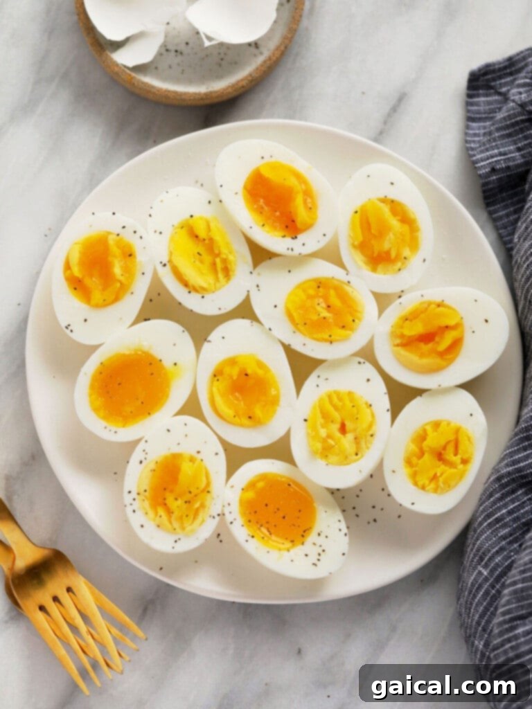15+ Creative Egg Breakfasts to Kickstart Your Day 8 A close-up of perfectly peeled hard boiled eggs, showcasing their smooth whites and firm yolks.